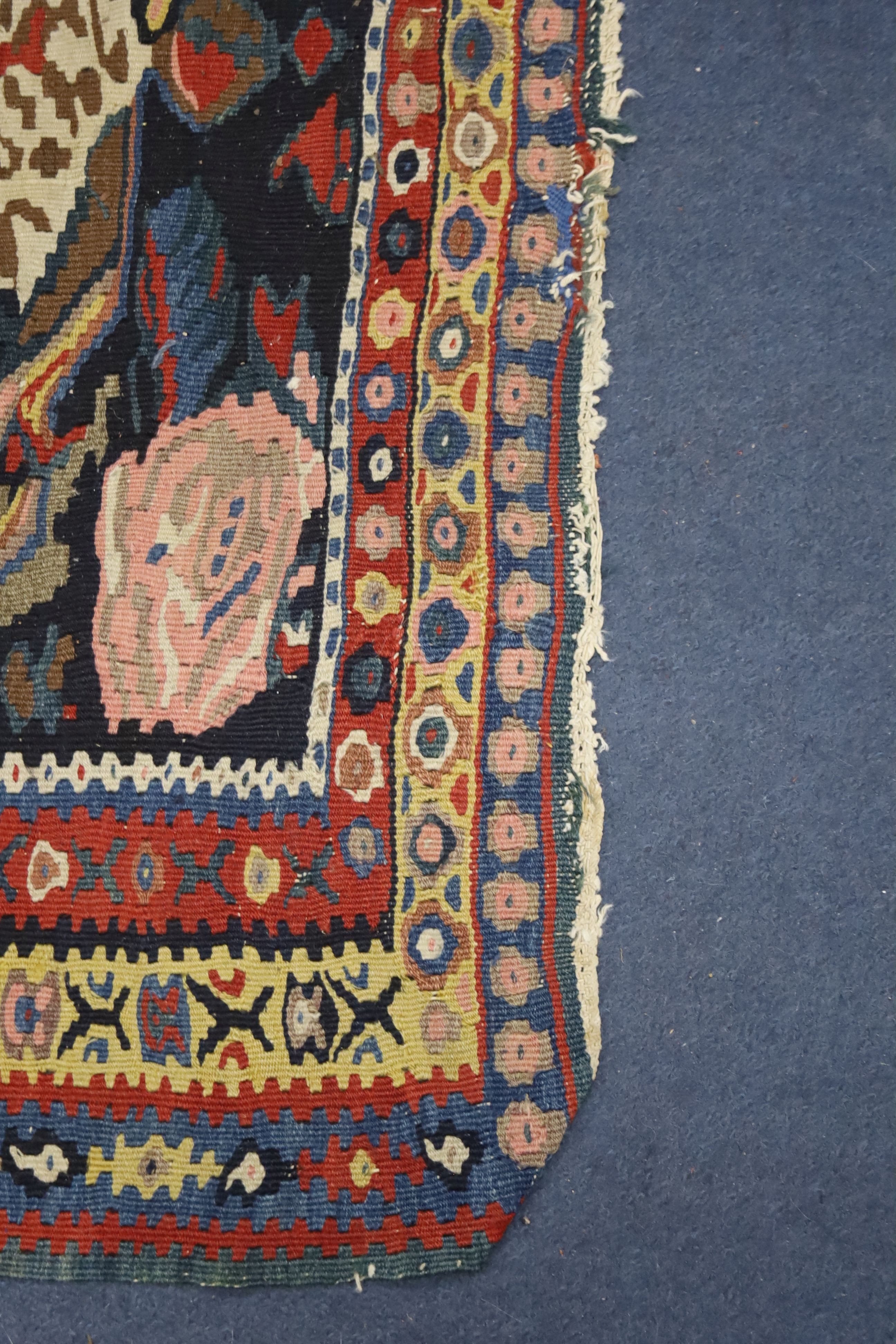 A late 19th century / early 20th century Senneh polychrome Kilim rug, 190 x 130cm